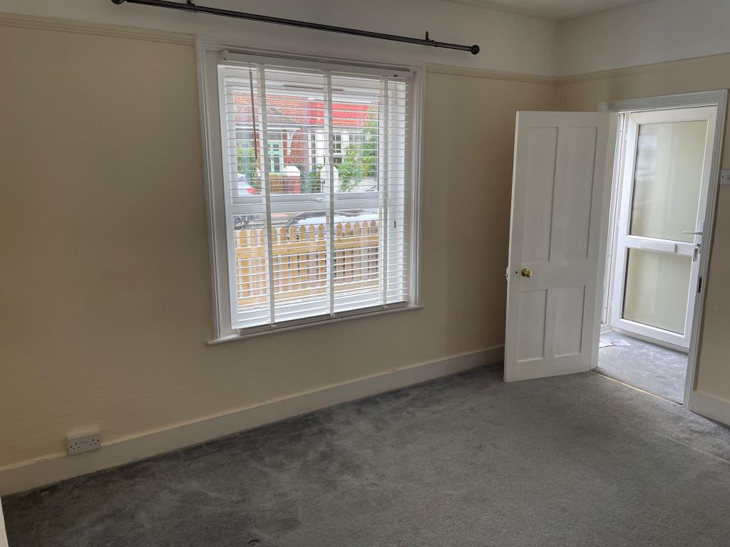 Lot: 42 - THREE-BEDROOM HOUSE WITH POTENTIAL - View of living room with door and window